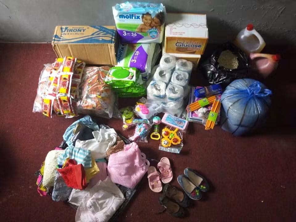 Nappies, food, clothes, shoes and school supplies laid out for donation